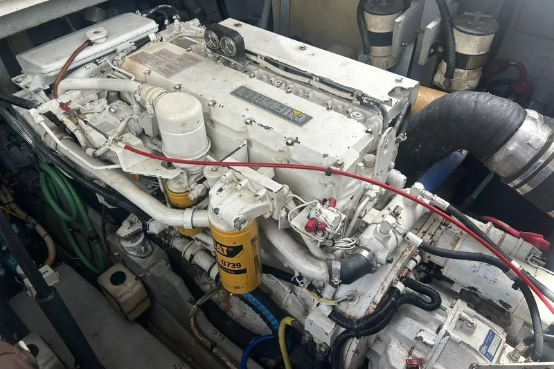 Slide: The Image of Engine of a 1997 Sea Ray 400 Sundancer boat, showcasing mechanical components. - 87