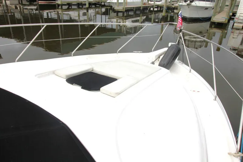 Slide: The Image of 1997 Silverton 402 Motor Yacht bow with railing, docked in marina. - 10