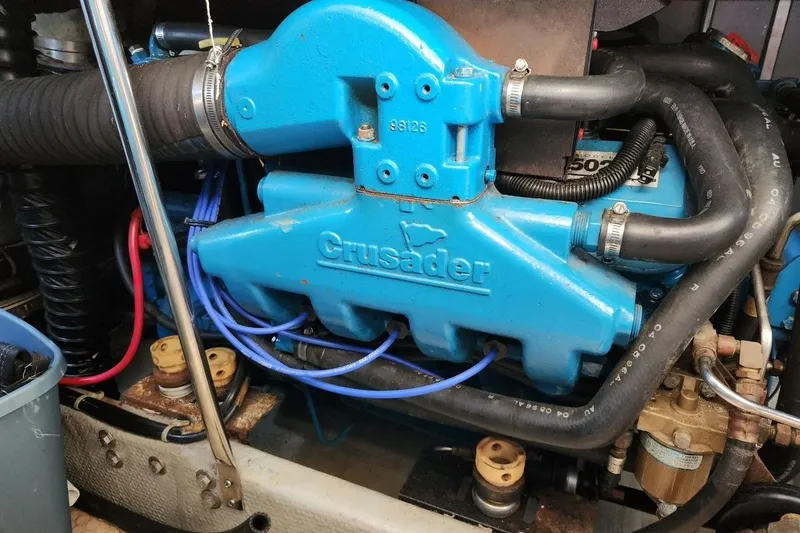 Slide: The Image of Engine of a 1997 Silverton 402 Motor Yacht with blue Crusader components. - 35