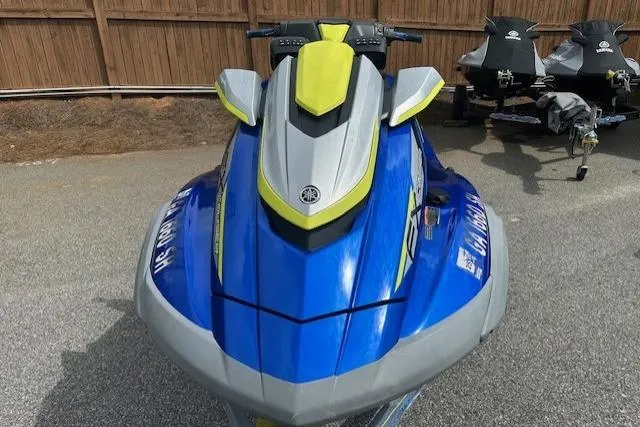 Slide: The Image of 2020 Yamaha WaveRunner FX Cruiser SVHO in blue and gray, parked on pavement. - 2
