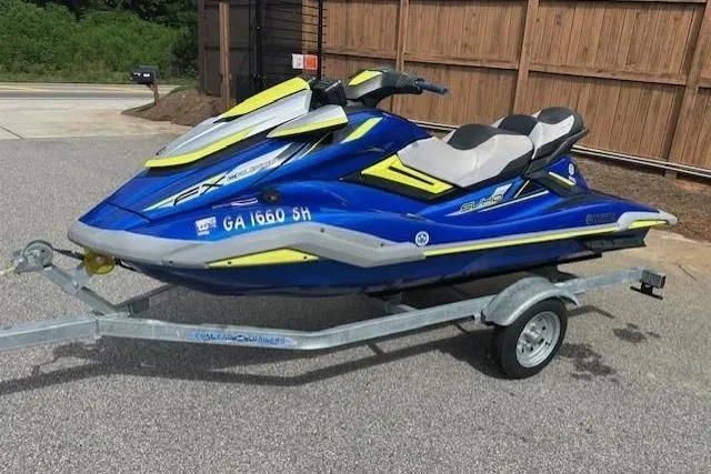 Slide: The Image of 2020 Yamaha WaveRunner FX Cruiser SVHO on trailer, blue and yellow design. - 3