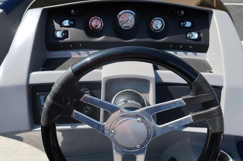 Slide: The Image of Steering wheel and dashboard of a 2021 Bennington 21 LL boat. - 10