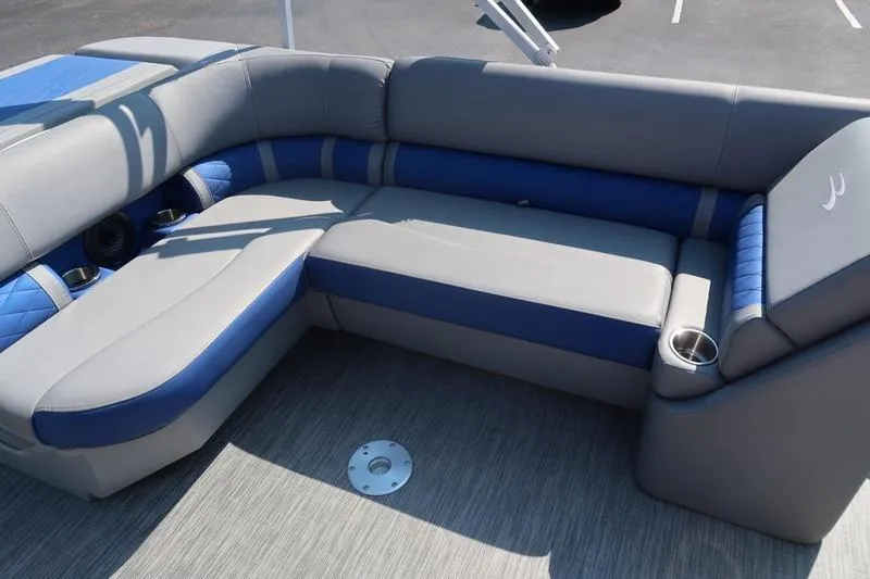 Slide: The Image of 2021 Bennington 21 LL boat interior with gray and blue cushioned seating. - 11