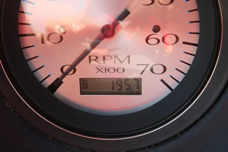 Slide: The Image of Close-up of a 2021 Bennington 21 LL RPM gauge displaying 195.7 hours. - 15