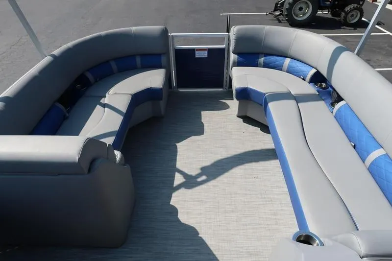 Slide: The Image of 2021 Bennington 21 LL pontoon boat interior with gray and blue seating. - 18