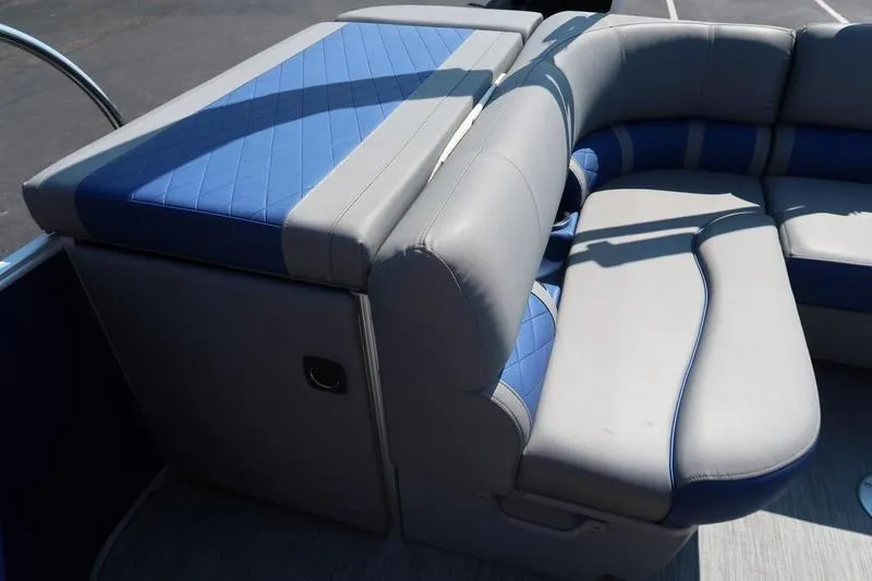 Slide: The Image of 2021 Bennington 21 LL boat interior with blue and gray seating. - 21