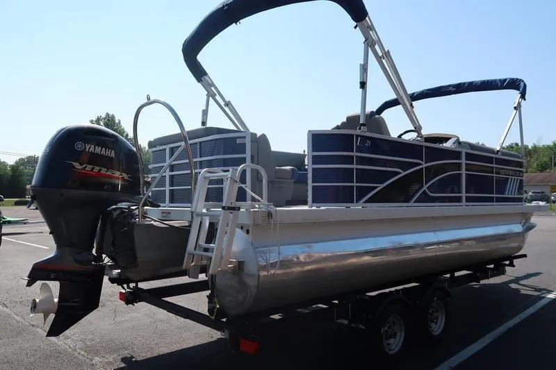 Slide: The Image of 2021 Bennington 21 LL pontoon boat with Yamaha outboard motor on trailer. - 3