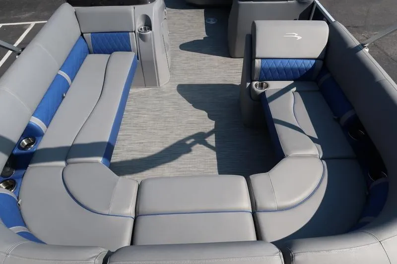 Slide: The Image of 2021 Bennington 21 LL pontoon boat interior with gray and blue seating. - 5
