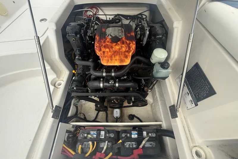 Slide: The Image of 2008 Monterey 254FS boat engine with custom flame design cover. - 20