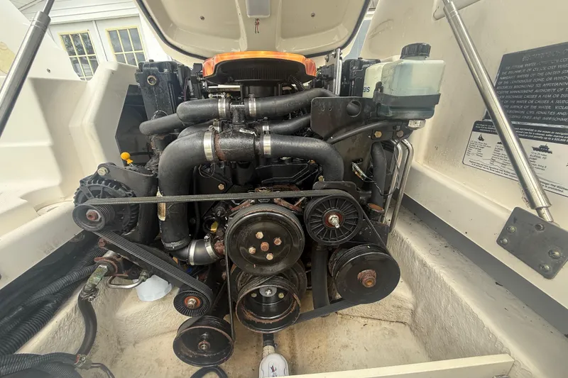 Slide: The Image of Engine compartment of a 2008 Monterey 254FS boat, showcasing mechanical components. - 21