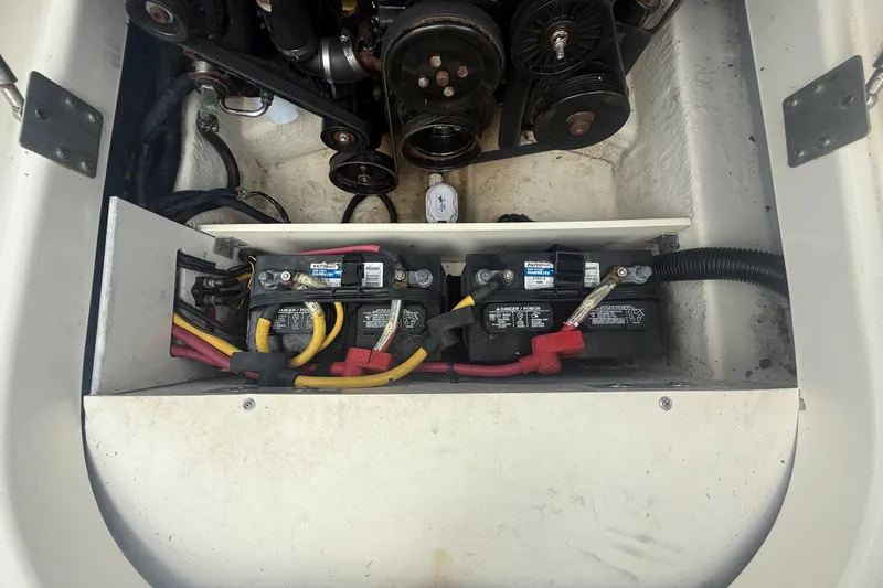 Slide: The Image of Engine compartment of a 2008 Monterey 254FS boat showing batteries and wiring. - 22