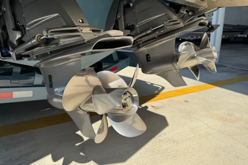 Slide: The Image of 2024 Cobalt R33 boat propellers in a sunny outdoor setting. - 17