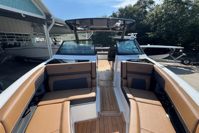 Slide: The Image of 2024 Cobalt R33 boat interior with luxurious seating and sleek design. - 24