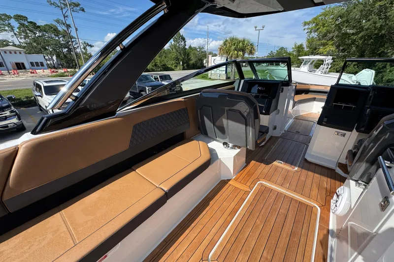 Slide: The Image of 2024 Cobalt R33 boat interior with luxurious seating and sleek design. - 35