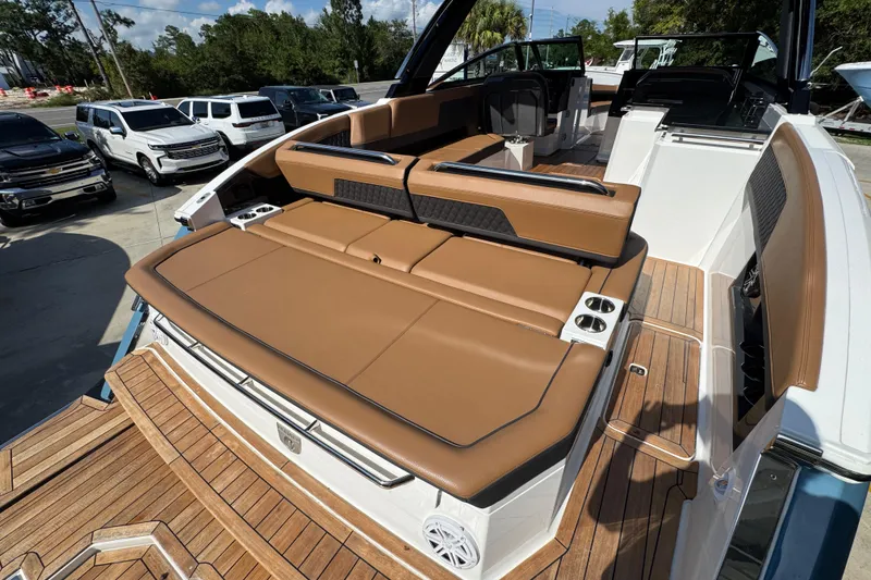 Slide: The Image of 2024 Cobalt R33 boat with luxurious tan seating and sleek design. - 41
