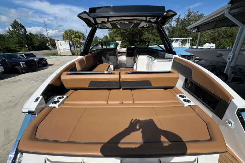 Slide: The Image of 2024 Cobalt R33 boat with luxurious tan seating and sleek design. - 42