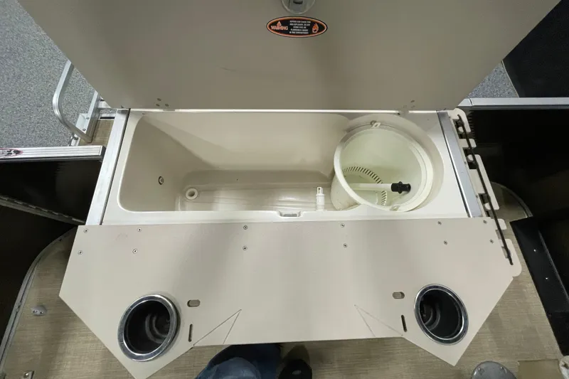 Slide: The Image of 2018 Crestliner FS 220 boat livewell with cup holders and storage compartment. - 11