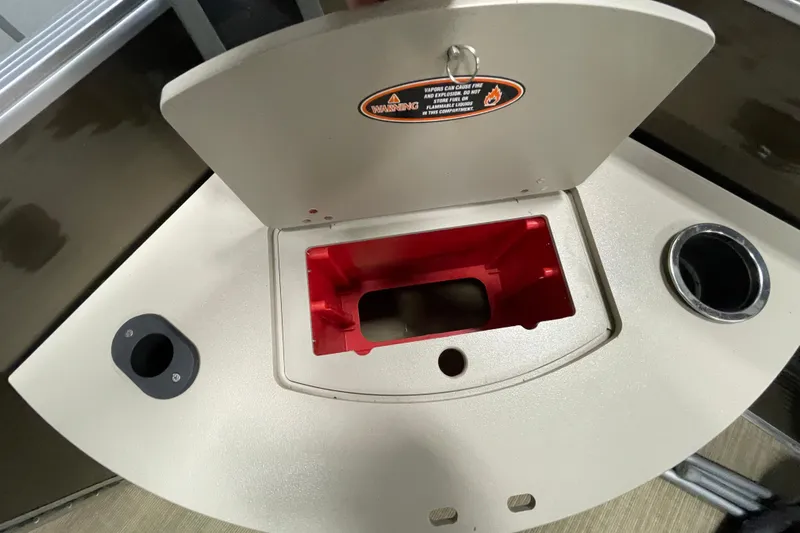 Slide: The Image of 2018 Crestliner FS 220 boat compartment with warning label and cup holder. - 16