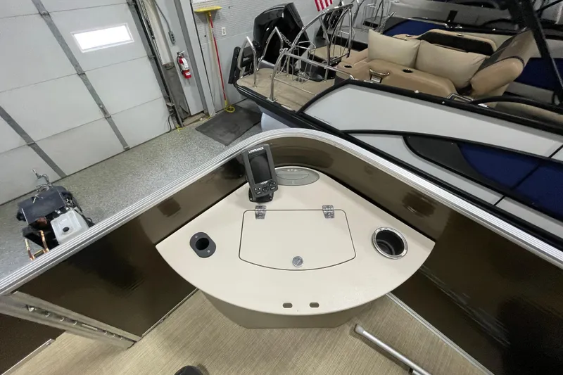 Slide: The Image of 2018 Crestliner FS 220 boat interior with control panel and seating area. - 17