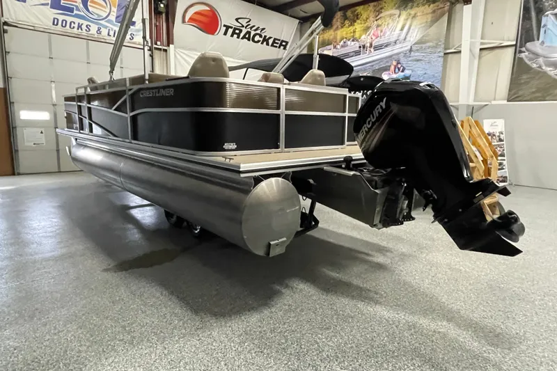 Slide: The Image of 2018 Crestliner FS 220 pontoon boat with Mercury outboard motor in showroom. - 3