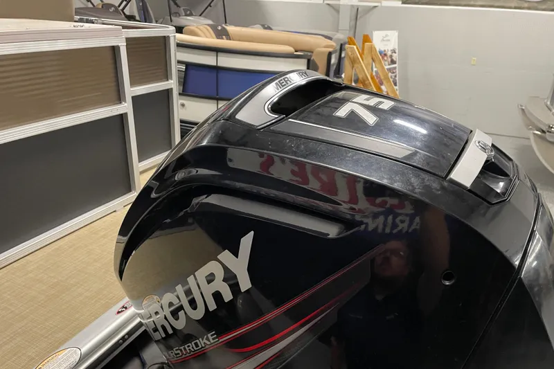 Slide: The Image of 2018 Crestliner FS 220 with Mercury outboard motor in showroom. - 6