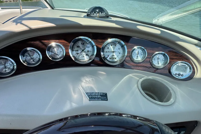 Slide: The Image of Dashboard of 2001 Chaparral 230 SSi boat with gauges and compass. - 13