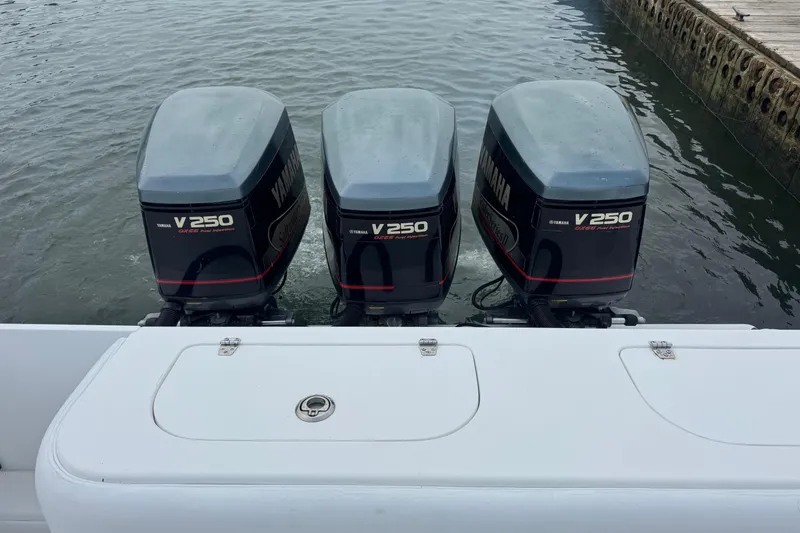 Slide: The Image of Triple Yamaha V250 outboard engines on a 2002 Contender 36 Open boat. - 15