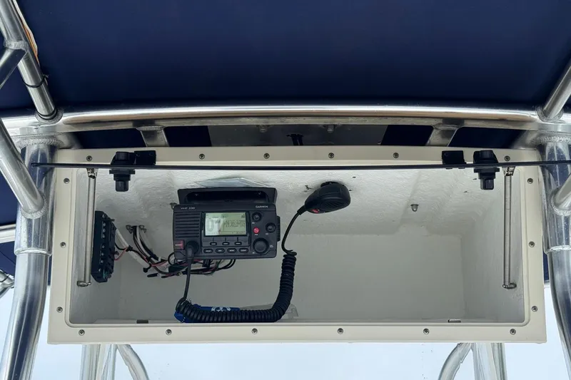 Slide: The Image of 2002 Contender 36 Open boat console with VHF radio and microphone. - 20