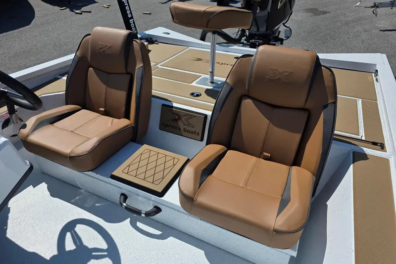 Slide: The Image of 2026 Xpress H20 Bass boat interior with brown leather seats and modern design. - 14