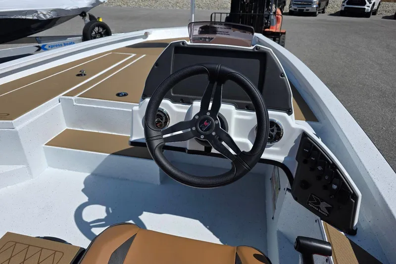 Slide: The Image of 2026 Xpress H20 Bass boat interior with steering wheel and control panel. - 15