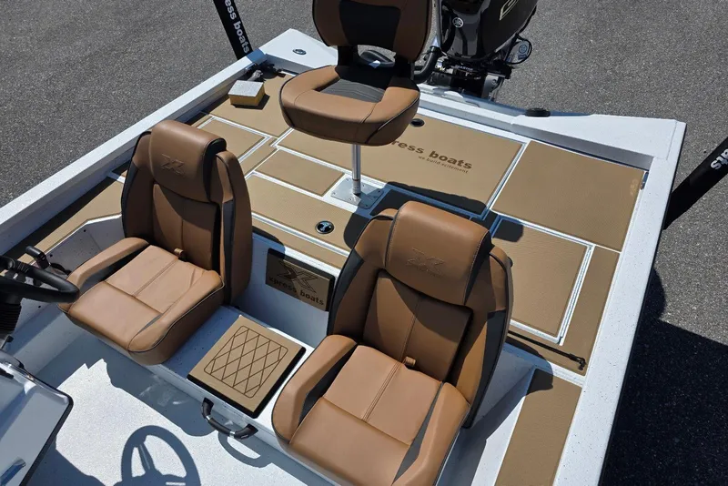 Slide: The Image of 2026 Xpress H20 Bass boat interior with tan seats and modern design. - 17