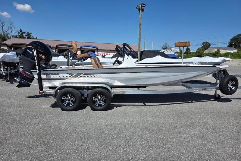 The Image of 2026 Xpress H20 Bass boat on trailer, featuring sleek design and powerful outboard motor. - 4