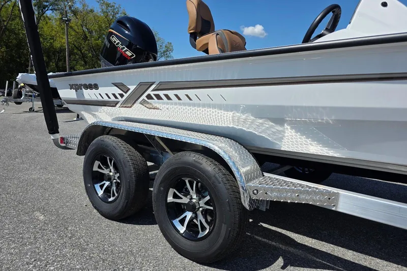 Slide: The Image of 2026 Xpress H20 Bass boat on trailer, featuring sleek design and dual wheels. - 6