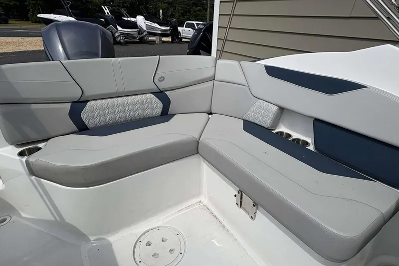 Slide: The Image of 2023 Hurricane SD 2400 boat interior seating with modern design and cup holders. - 11