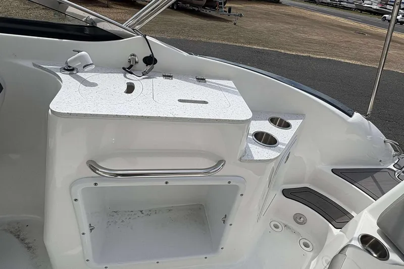 Slide: The Image of 2023 Hurricane SD 2400 boat interior with sink and cup holders. - 12