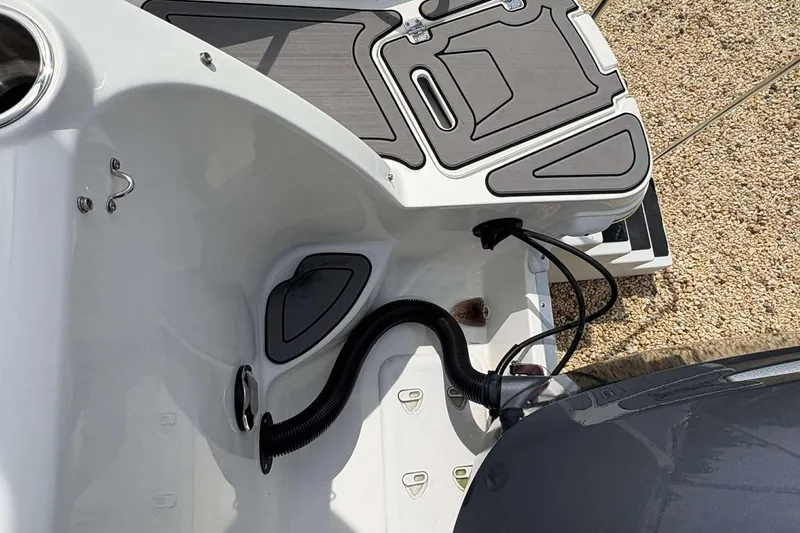 Slide: The Image of 2023 Hurricane SD 2400 boat deck with engine and wiring details. - 16