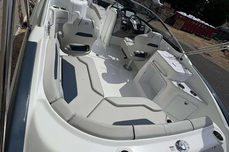 Slide: The Image of 2023 Hurricane SD 2400 boat interior with seating and steering console. - 2