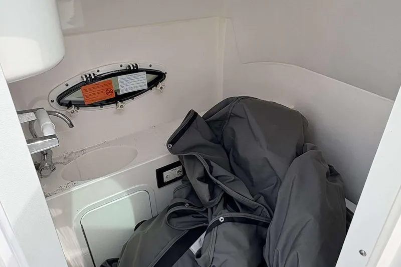 Slide: The Image of 2023 Hurricane SD 2400 boat interior with sink and storage area. - 8