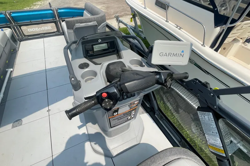 Slide: The Image of 2023 Sea-Doo Switch 21-230 dashboard with Garmin navigation system and steering controls. - 7