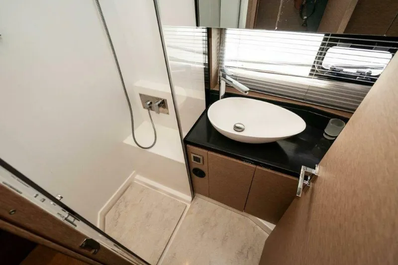 Slide: The Image of 2017 Prestige 460 Flybridge- "Can't Anchor Us"- Master Head - 14