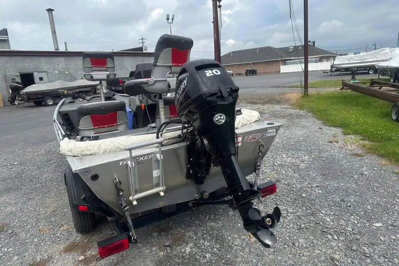 Slide: The Image of 2015 Tracker Pro 160 boat with Mercury 20 engine, parked on gravel lot. - 3