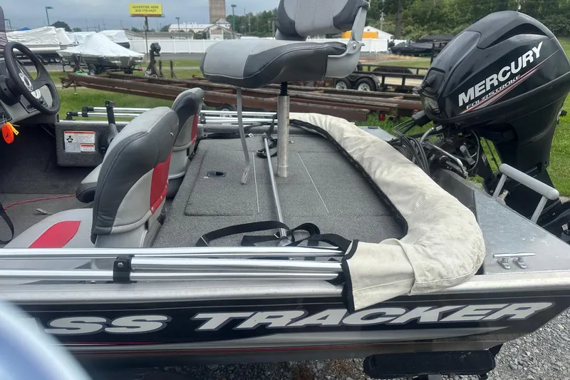 Slide: The Image of 2015 Tracker Pro 160 boat with Mercury engine, featuring comfortable seating and spacious deck. - 4