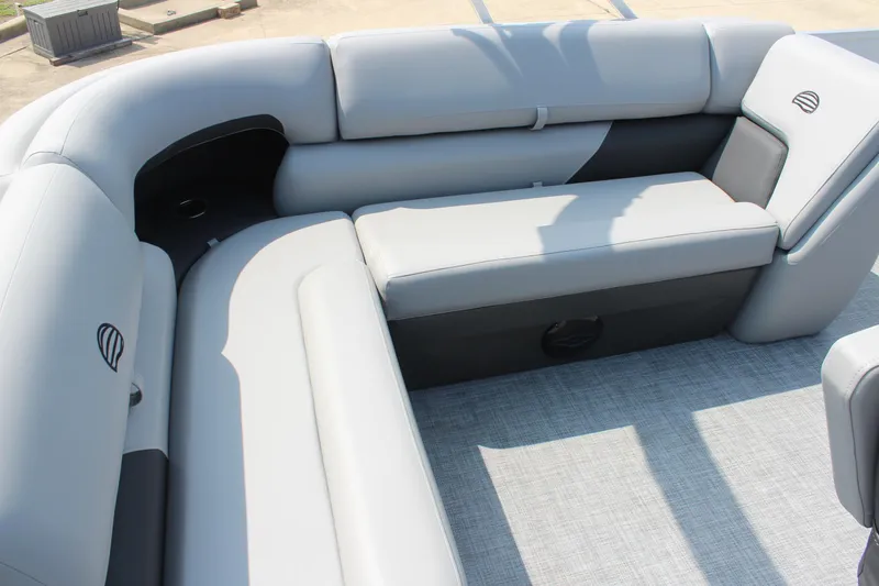 Slide: The Image of 2026 Sun Tracker Party Barge 20 DLX interior with gray cushioned seating. - 18