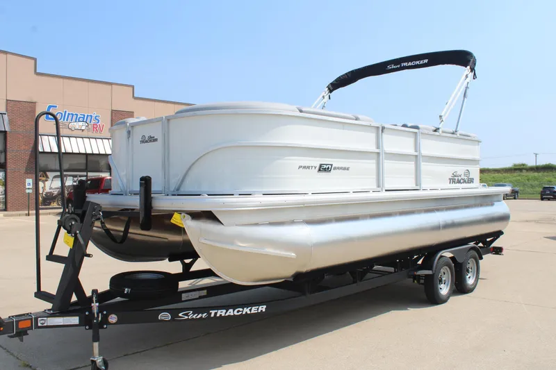 Slide: The Image of 2026 Sun Tracker Party Barge 20 DLX pontoon boat on trailer at dealership. - 8