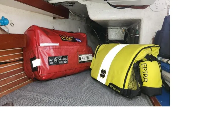 Slide: The Image of Red and yellow emergency bags on a boat, Peacock 35, 1984 model. - 7