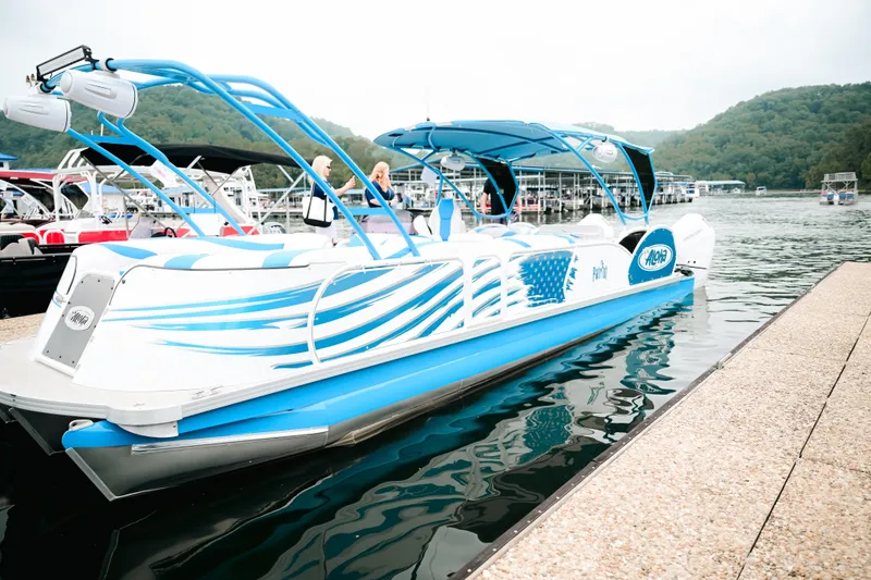 Slide: The Image of 2026 Aloha Pontoon Paradise Twin X32 docked on a scenic lake. - 2