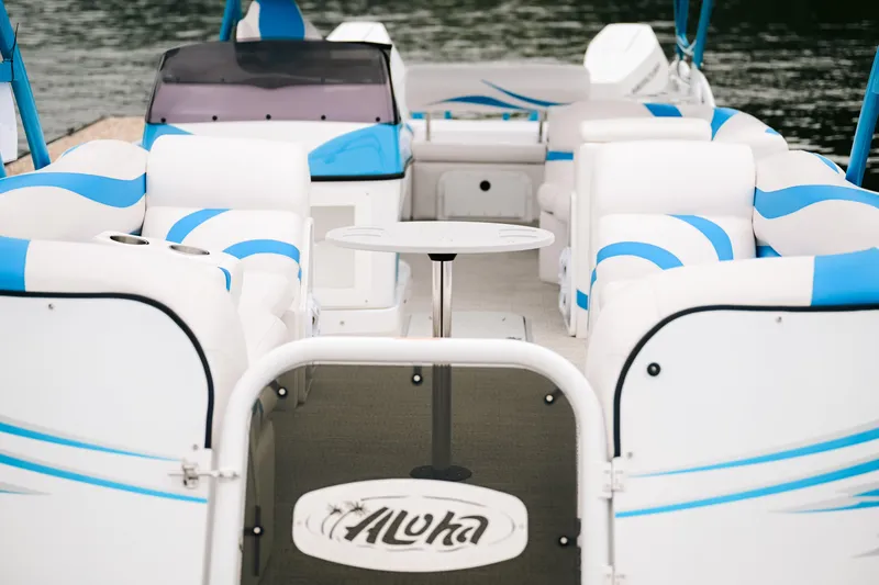 Slide: The Image of 2026 Aloha Pontoon Paradise Twin X32 with spacious seating and modern design on the water. - 3