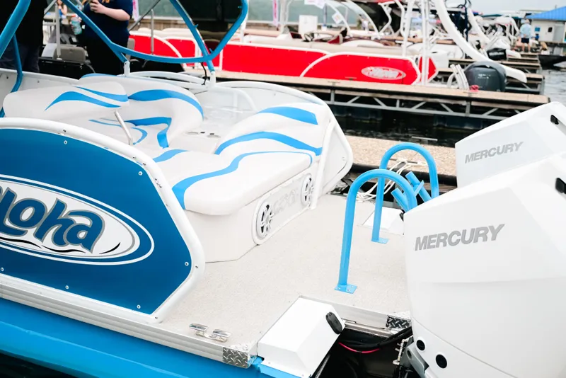 Slide: The Image of 2026 Aloha Pontoon Paradise Twin X32 with Mercury engines at a marina dock. - 4