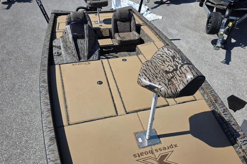 Slide: The Image of 2026 Xpress H20 Bass boat with camo seating and spacious deck layout. - 20