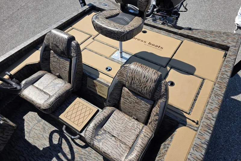Slide: The Image of 2026 Xpress H20 Bass boat interior with camo seats and spacious deck layout. - 24